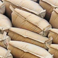 Pile sacks in warehouse